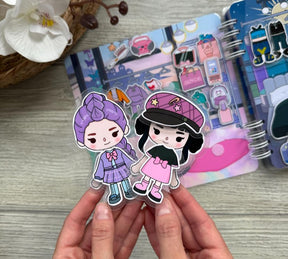 LIVRO INTERATIVO GUERREIRAS DO K-POP E SAJA BOYS